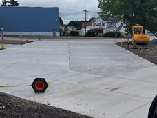 A new concrete parking lot is in the process of curing.