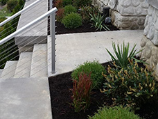 Landscaping is implemented into this concrete break wall design.
